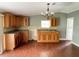 Kitchen with wood cabinets and laminate flooring at 17889 Thomas Blvd, Hudson, FL 34667