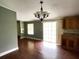 Dining room with laminate flooring and access to the backyard at 17889 Thomas Blvd, Hudson, FL 34667