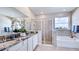 Spa-like bathroom with double vanity, shower, and soaking tub at 4302 Pullet Ct, Lakewood Ranch, FL 34211
