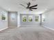 Spacious bedroom with ceiling fan and multiple windows at 31982 Bourneville Ter, Wesley Chapel, FL 33543