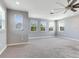 Spacious bedroom with ceiling fan and multiple windows at 31982 Bourneville Ter, Wesley Chapel, FL 33543