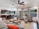 Open concept living room with kitchen views and comfortable seating at 31982 Bourneville Ter, Wesley Chapel, FL 33543