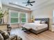 Spacious main bedroom with a king-size bed and plenty of natural light at 31982 Bourneville Ter, Wesley Chapel, FL 33543