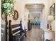 Inviting entryway with a wooden bench, decorative accents, and views to the living areas at 31982 Bourneville Ter, Wesley Chapel, FL 33543