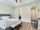 Main bedroom with king-size bed and en-suite bathroom access at 31982 Bourneville Ter, Wesley Chapel, FL 33543