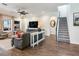 Living room with comfortable seating and large TV at 31982 Bourneville Ter, Wesley Chapel, FL 33543