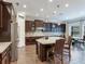 Gourmet kitchen with large island, stainless steel appliances, and ample cabinetry at 31982 Bourneville Ter, Wesley Chapel, FL 33543