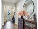 Elegant entryway with tile flooring, decorative accents, and a charming bench at 31982 Bourneville Ter, Wesley Chapel, FL 33543