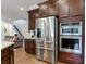 Modern kitchen with stainless steel appliances and granite countertops at 31982 Bourneville Ter, Wesley Chapel, FL 33543