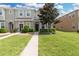 Townhouse exterior showcasing front entrance and landscaping at 7016 White Treetop Pl, Riverview, FL 33578