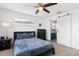 Bedroom with queen bed, en-suite bathroom, and barn door at 7016 White Treetop Pl, Riverview, FL 33578