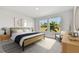 Cozy bedroom with a large window, natural light, and modern furnishings at 11814 Richmond Trl, Parrish, FL 34219