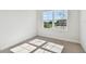 Bright bedroom with neutral carpet, natural light, and a large window at 11814 Richmond Trl, Parrish, FL 34219