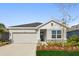 Charming one-story home featuring a two-car garage and beautifully landscaped front yard at 11814 Richmond Trl, Parrish, FL 34219