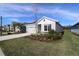 Charming single-story home featuring a manicured lawn, attached garage, and well-maintained landscaping at 11814 Richmond Trl, Parrish, FL 34219