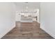 Hallway view to kitchen area with hardwood floors at 11814 Richmond Trl, Parrish, FL 34219