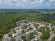 Aerial view of a home situated in a residential area near a pond at 1419 Trail Boss Ln, Brandon, FL 33511