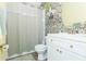 Updated bathroom with a patterned shower and modern vanity at 1419 Trail Boss Ln, Brandon, FL 33511