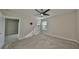 Neutral bedroom with carpet, a ceiling fan, and a window at 16850 Whisper Elm St, Wimauma, FL 33598