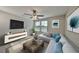 Comfortable living room with modern decor, neutral palette, and plenty of natural light at 16850 Whisper Elm St, Wimauma, FL 33598