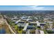 Expansive aerial view of a condominium community featuring lush landscaping and multiple residential buildings at 2460 Canadian Way # 64, Clearwater, FL 33763