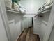 Functional walk-in closet with mirrored door, shelving, and rod offering ample storage space at 3730 42Nd S Way # H, St Petersburg, FL 33711