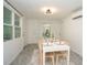 Clean dining area with a white table and chairs, near the kitchen at 1843 Oregon Ne Ave, St Petersburg, FL 33703