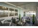 Relaxing screened porch with wicker furniture and view of backyard at 1843 Oregon Ne Ave, St Petersburg, FL 33703