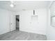 Bedroom with built-in white closet and ceiling fan at 1843 Oregon Ne Ave, St Petersburg, FL 33703