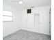 Bedroom with white built-in closet and ceiling fan at 1843 Oregon Ne Ave, St Petersburg, FL 33703