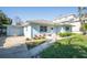 Light blue house with attached garage and walkway at 1843 Oregon Ne Ave, St Petersburg, FL 33703