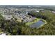 Aerial view of the community near a pond at 25151 Geddy Dr, Land O Lakes, FL 34639