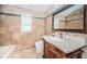 Bathroom with granite vanity and bathtub at 2675 Firestone Dr, Clearwater, FL 33761