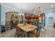 Elegant dining area with a stone table and chandelier at 1105 Wellington Greens Cir # 1105, Sun City Center, FL 33573