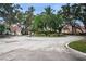 Community entrance with lush landscaping and guard house at 3730 42Nd S Way # H, St Petersburg, FL 33711