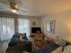 Living room with comfy sofas, wood floors, and sliding glass doors at 3730 42Nd S Way # H, St Petersburg, FL 33711