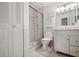 Clean bathroom with shower, toilet and vanity at 2102 Hailstone Cir, Sun City Center, FL 33573