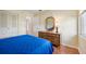 Bedroom with double bed, dresser and wood floors at 2102 Hailstone Cir, Sun City Center, FL 33573