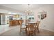 Bright dining area with a glass-top table and kitchen views at 2102 Hailstone Cir, Sun City Center, FL 33573