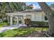 Front view of a single-story home with a carport and landscaping at 2102 Hailstone Cir, Sun City Center, FL 33573