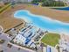 Aerial view of community with resort-style pool at 16850 Whisper Elm St, Wimauma, FL 33598