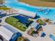 Aerial view of resort-style pool area with cabanas and shaded seating at 16850 Whisper Elm St, Wimauma, FL 33598