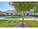 Exterior of home with landscaping and sidewalk at 16850 Whisper Elm St, Wimauma, FL 33598