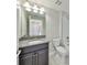 Bathroom with granite countertop and dark vanity at 16850 Whisper Elm St, Wimauma, FL 33598