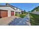 Exterior view of home with two-car garage at 16850 Whisper Elm St, Wimauma, FL 33598