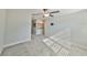 Spacious bedroom with ceiling fan and carpet flooring at 16850 Whisper Elm St, Wimauma, FL 33598