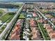 Aerial view showcasing a home's location in a planned community at 16850 Whisper Elm St, Wimauma, FL 33598