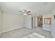 Large bedroom with ceiling fan and ensuite bathroom at 16850 Whisper Elm St, Wimauma, FL 33598