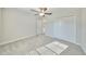 Spacious bedroom with ceiling fan and carpet flooring at 16850 Whisper Elm St, Wimauma, FL 33598