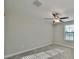Bright bedroom with ceiling fan and window at 16850 Whisper Elm St, Wimauma, FL 33598